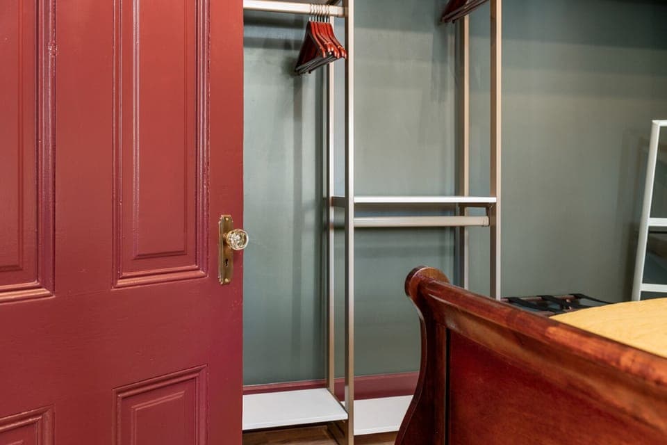 Wardrobe in bedroom closet is adjustable for storage needs