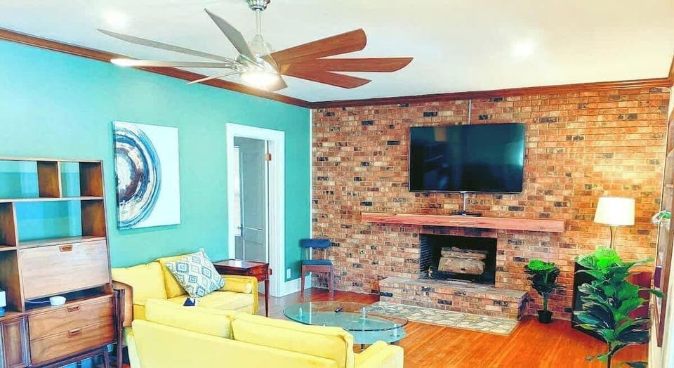 Large front Living room with 2 additional seating areas.