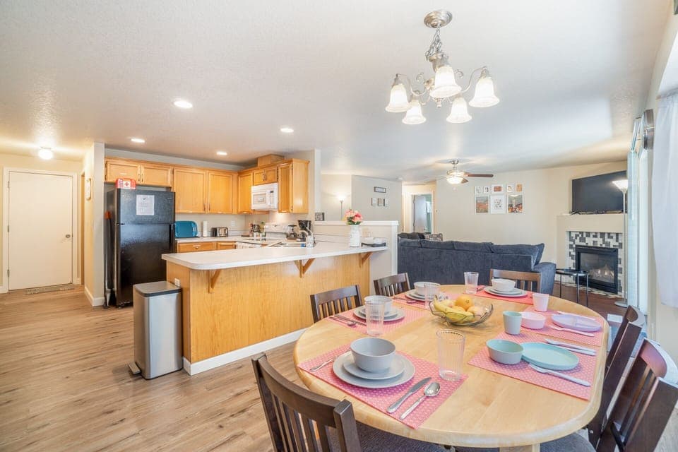 Dining table can set up to 8. Two more dining chairs are in the entry closet.