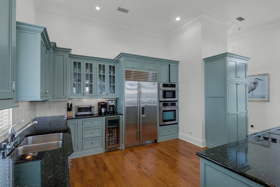 Large well appointed kitchen with stainless steel appliances.