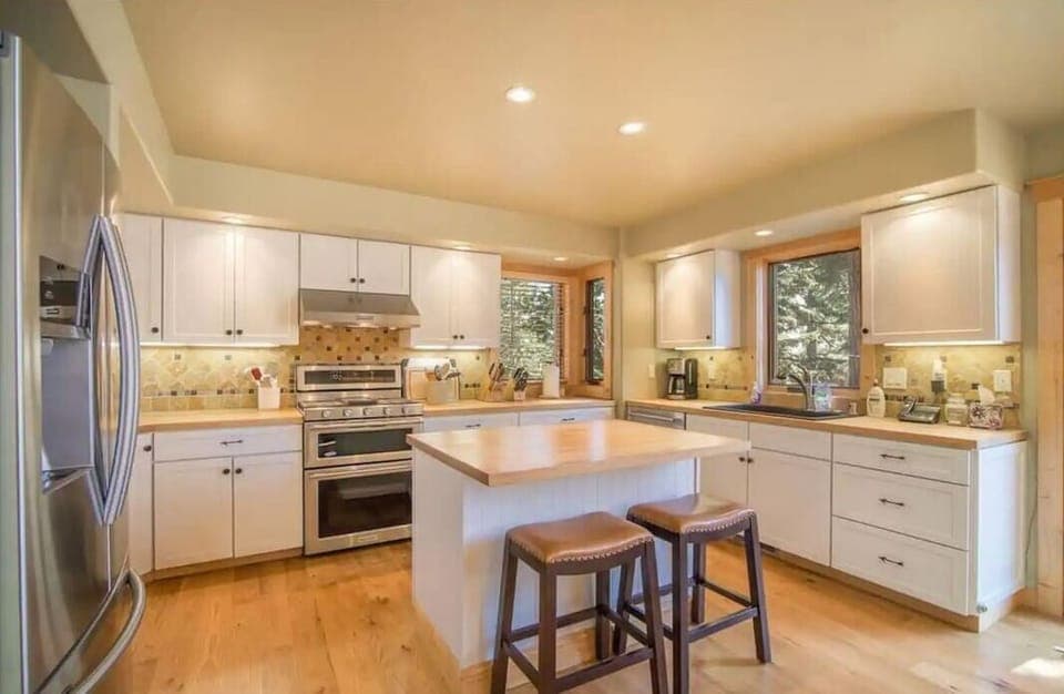The generous kitchen offers butcher block counter tops
