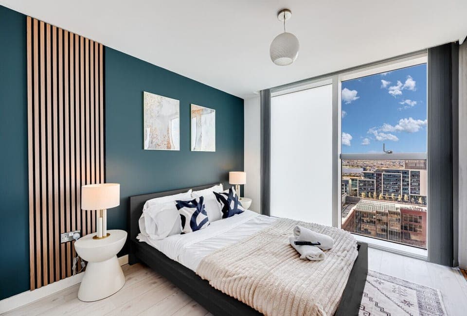 The bedroom has a double bed with fresh linen and towels provided.