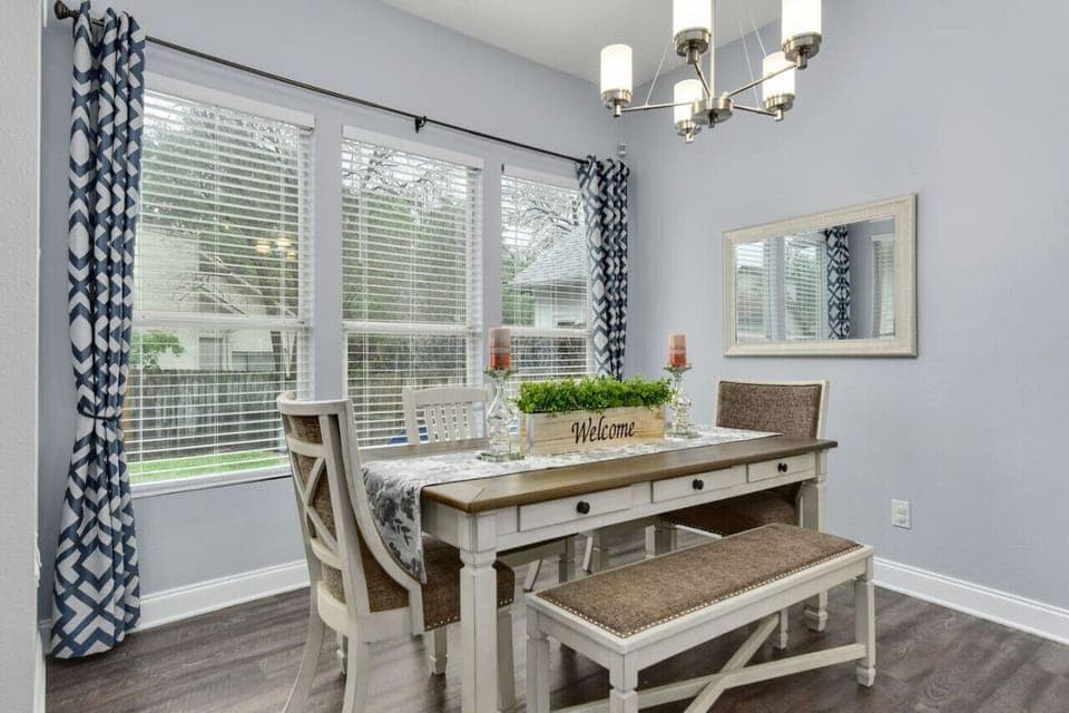 Bright dining room with backyard view at Water Well Wonder—perfect for extended stays.