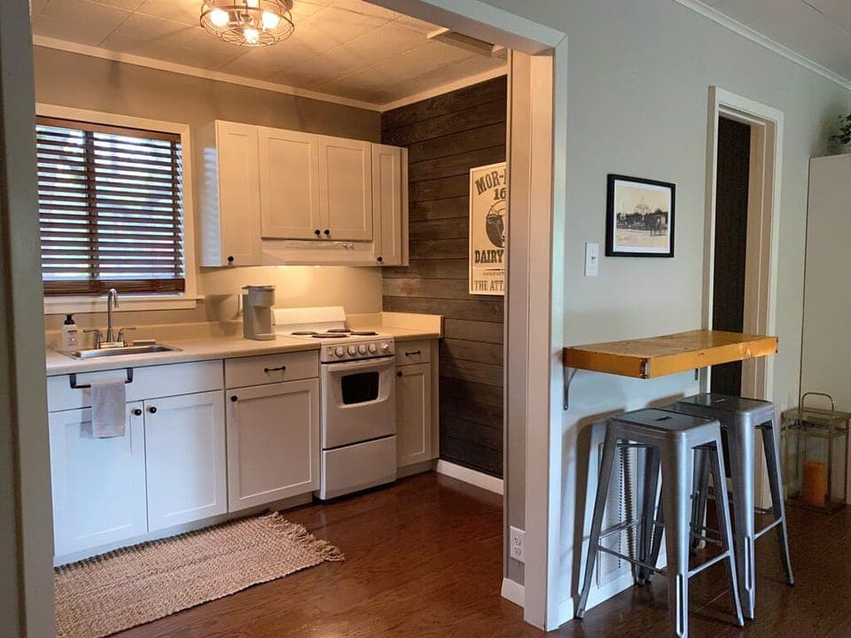 Kitchen boasts oven, full fridge, microwave and coffee makers.