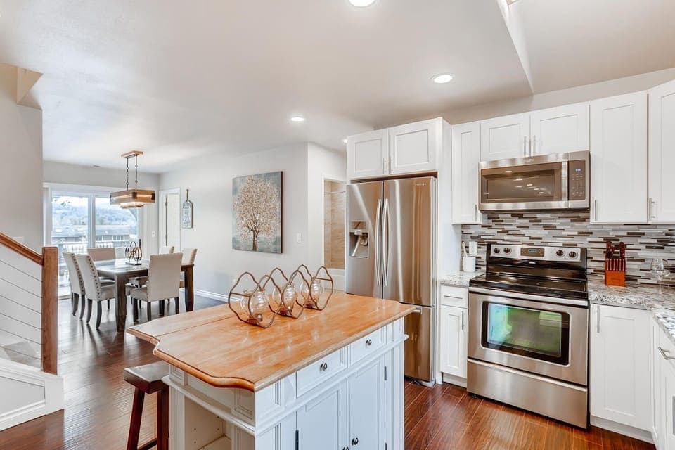Big Kitchen with Farmhouse Island with 2 bar stools