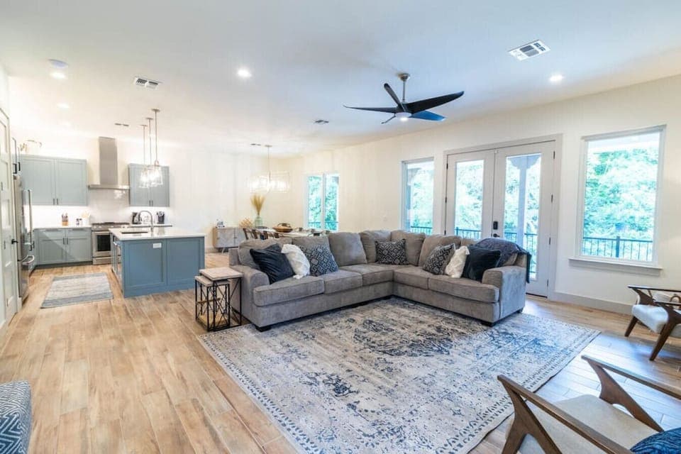 Magnolia River Haus - Large living room with oversized sectional couch