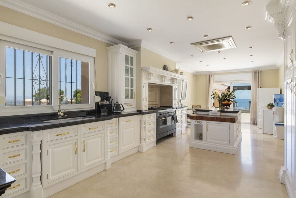 large kitchen with fridge, freezer and drinks fridge