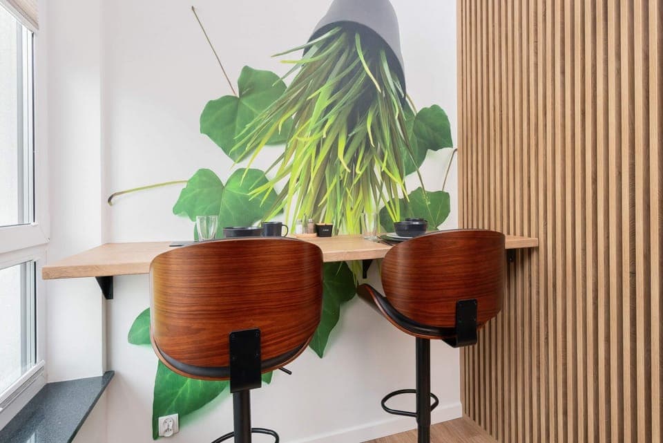 Dining area with high top and bar chairs.