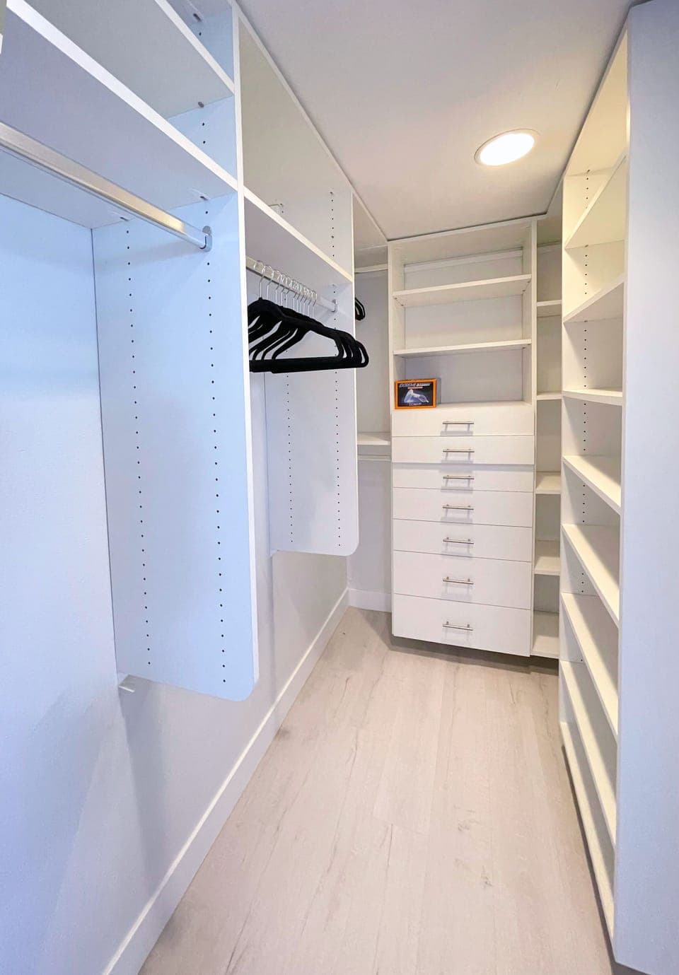 One of two closets in primary bedroom