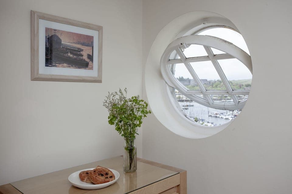 Porthole window with view from master bedroom - Waterview House