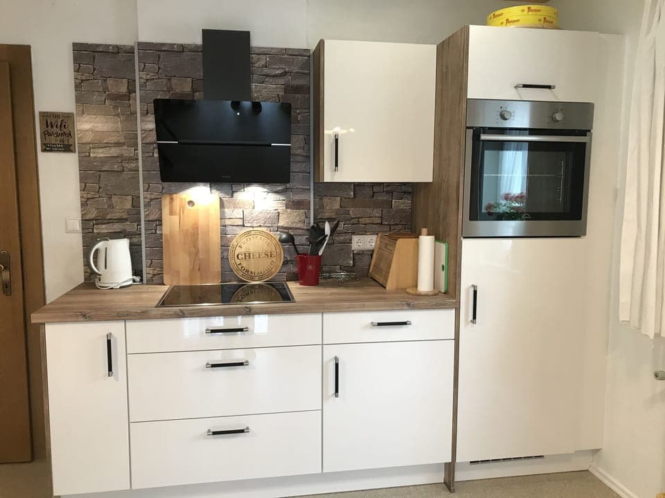 Brand new, fully fitted kitchen with fridge freezer, oven, hob and dishwasher.