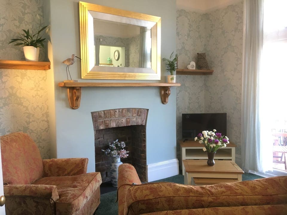 Comfy Lounge with doors to Balcony 