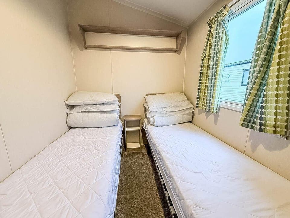 Families love the twin bedroom setup in our static caravan for their perfect family holiday in Essex.