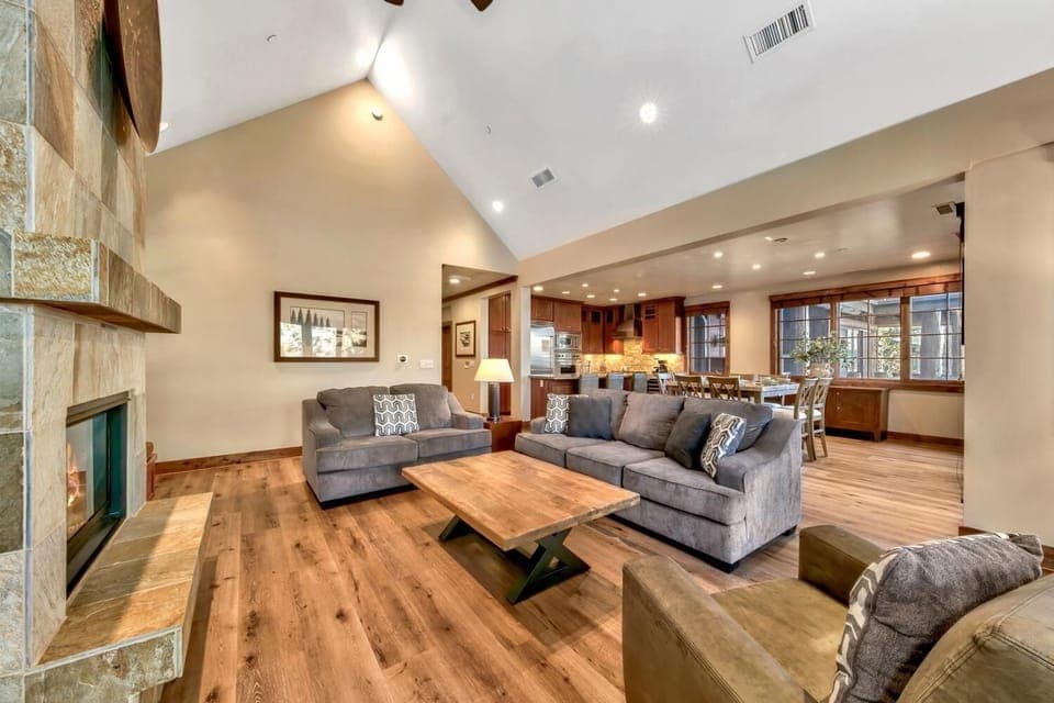 Flow seamlessly between the living room, dining area, and kitchen in this open-concept layout.