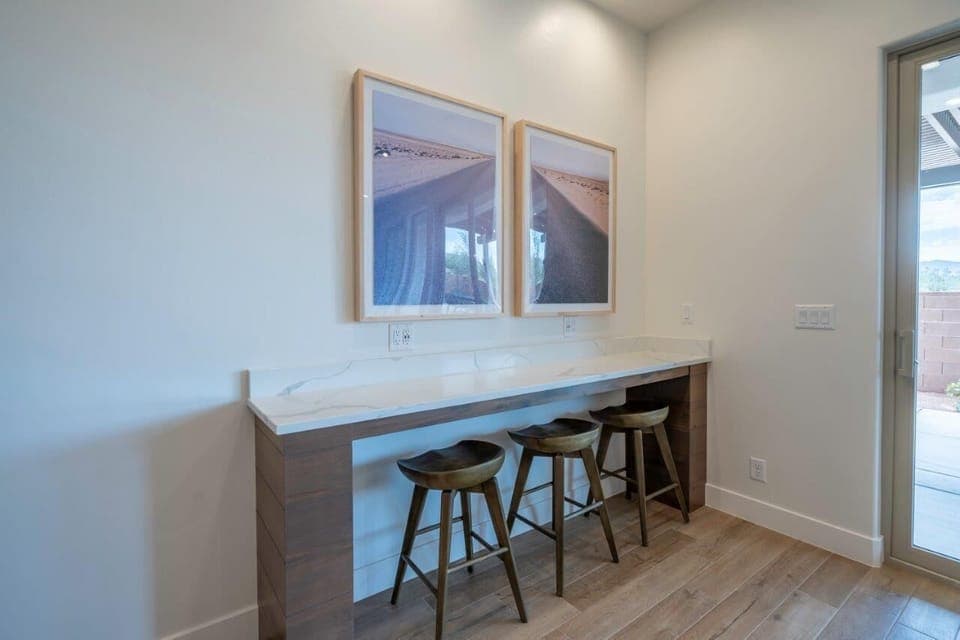 Additional bar seating for 3 (located behind the dining room table)