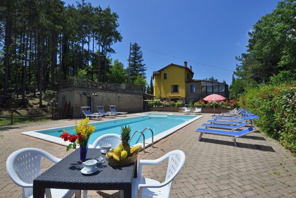 The property and area pool with the wide solarium