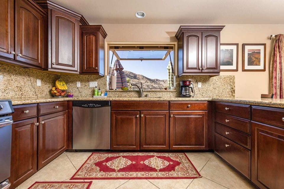 Large, fully stocked kitchen with all of your cooking/baking necessities. A large pass-through window opens straight to the BBQ grill to keep the conversations (and drinks) flowing between the indoors and outdoors.