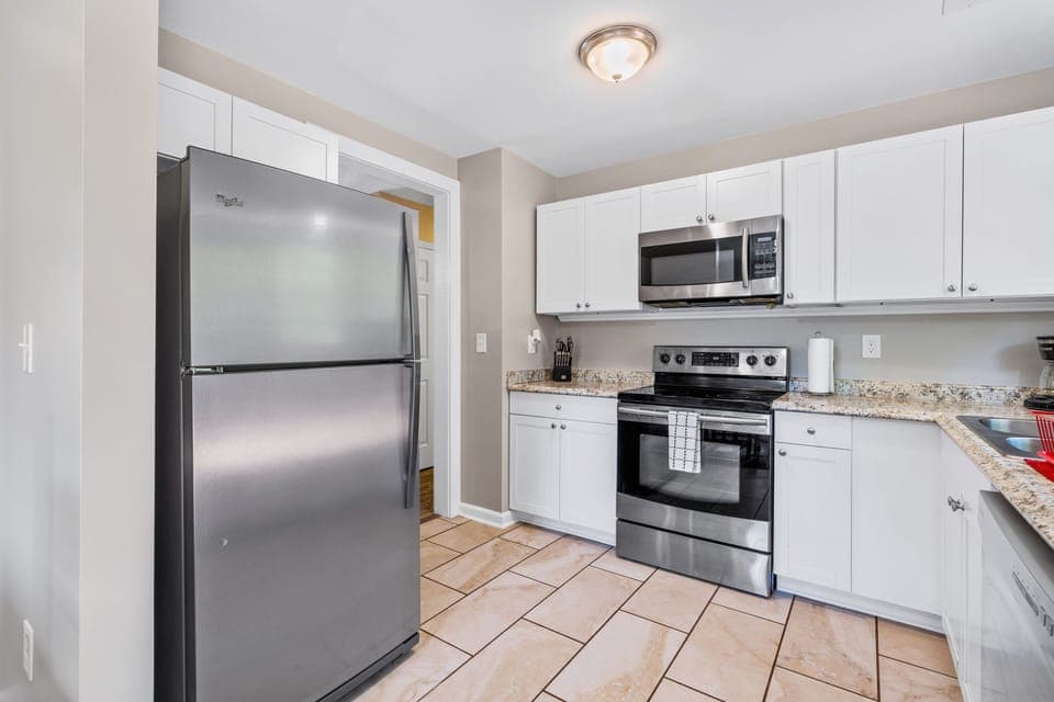 Full Kitchen stocked with plenty of cookware, silverware  and dinnerware