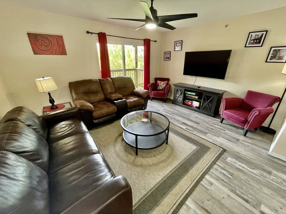 Family room with sleeper sofa and loveseat and 55" smart TV
