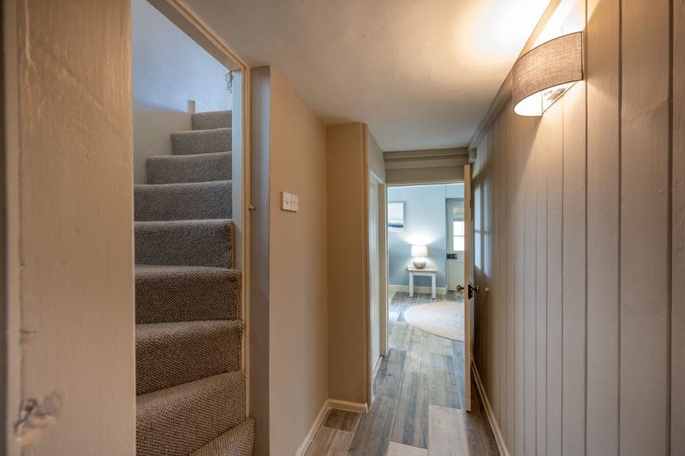 Ground floor: Steep stairs lead to the first floor