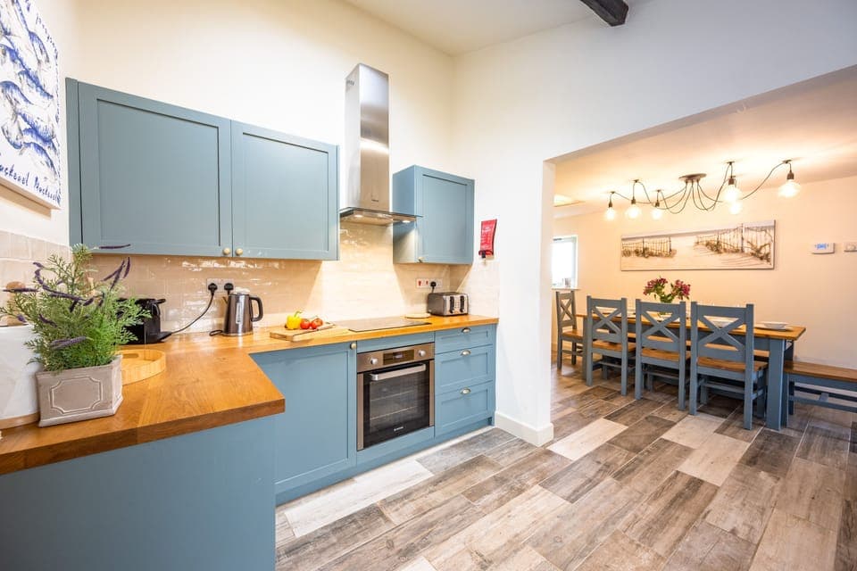 Eastgate Cottage and Hideaway, Salthouse: Well-equipped kitchen with dining area beyond