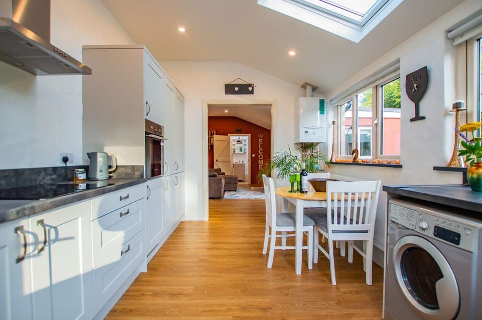 A full length view of the well equipped kitchen/diner and comfortable lounge.