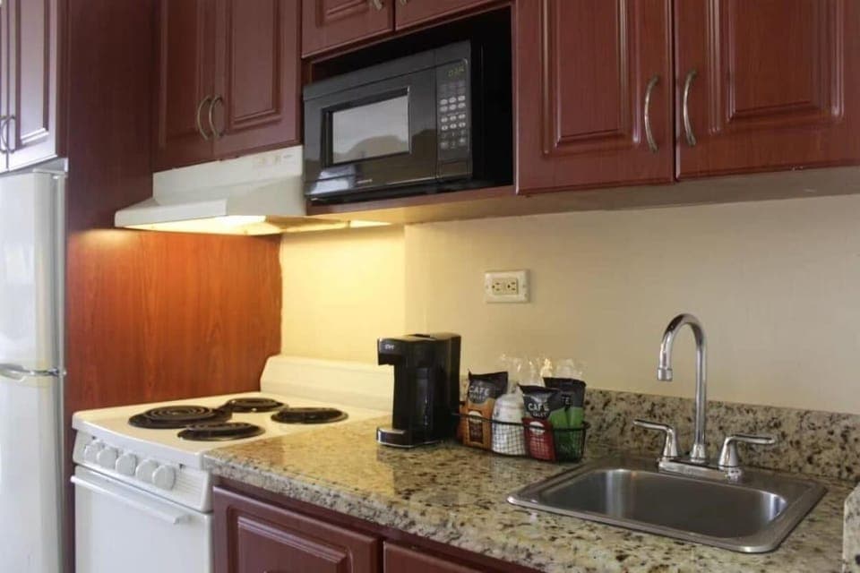 Kitchen. Bedroom. Views, colors, and decor may vary.