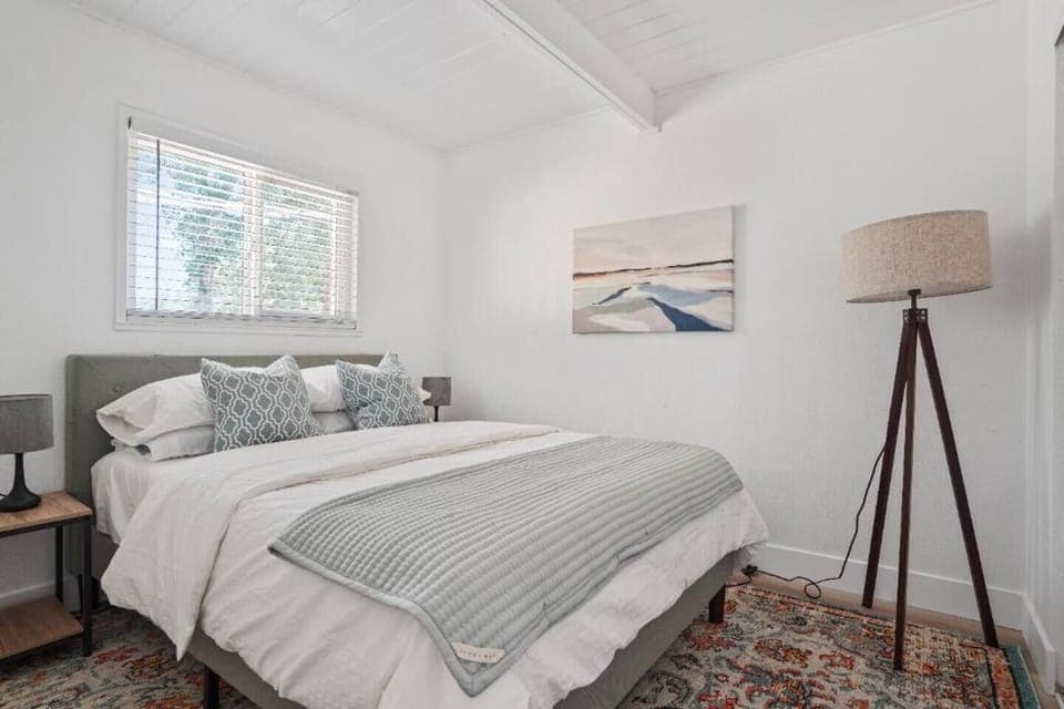 Guest bedroom #2 with a queen-sized bed.