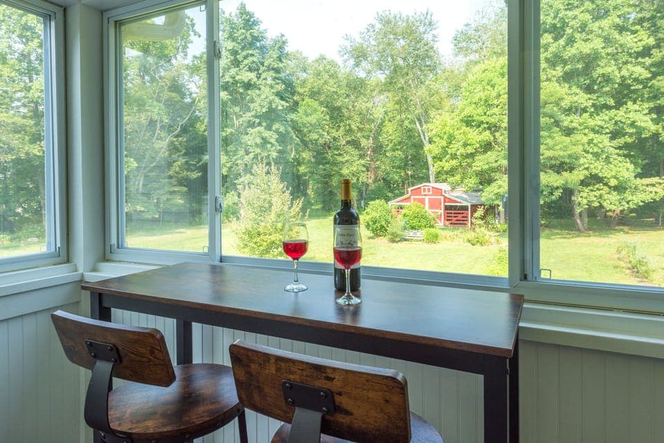 Sunroom overlooks the beautiful backyard