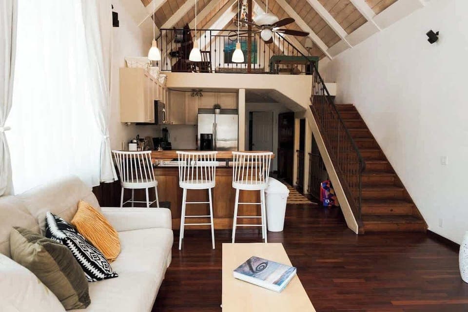 With vaulted ceilings, an open-concept kitchen, and a cozy living room, this space is perfect for families, couples, or solo travelers. Relax in a bright, airy environment with large windows that bring in natural light, and stylish decor.