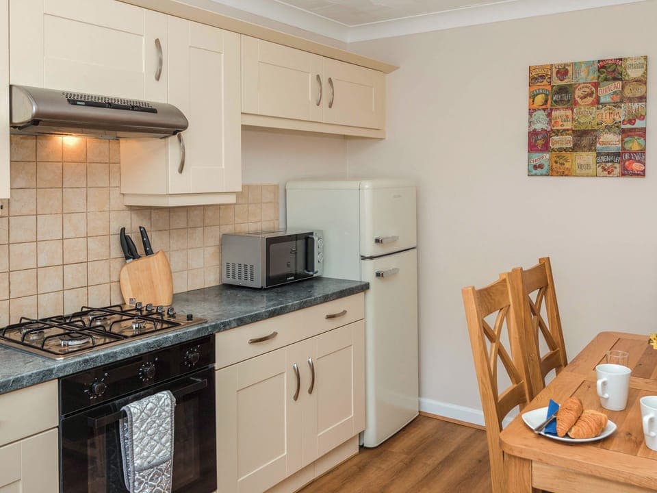 Kitchen | Puffin Cottage - Celtic Haven Resort, Lydstep, near Tenby