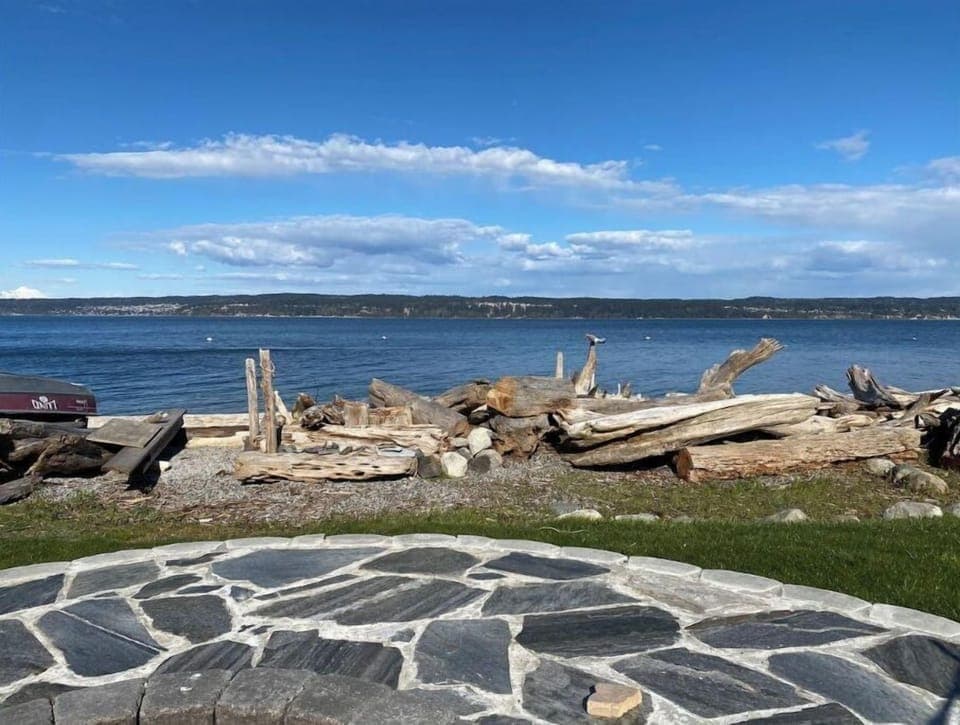 View east to Camano Island from backyard fire pit. Mount Baker seen on far left.