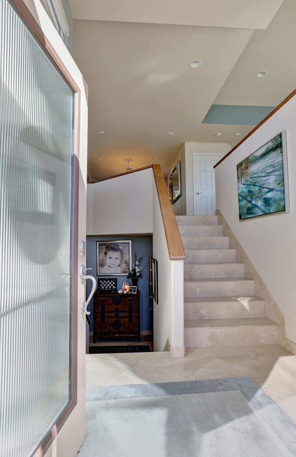 Split level entry. At first level is the guest bedroom with ensuite bathroom, office and garage access.