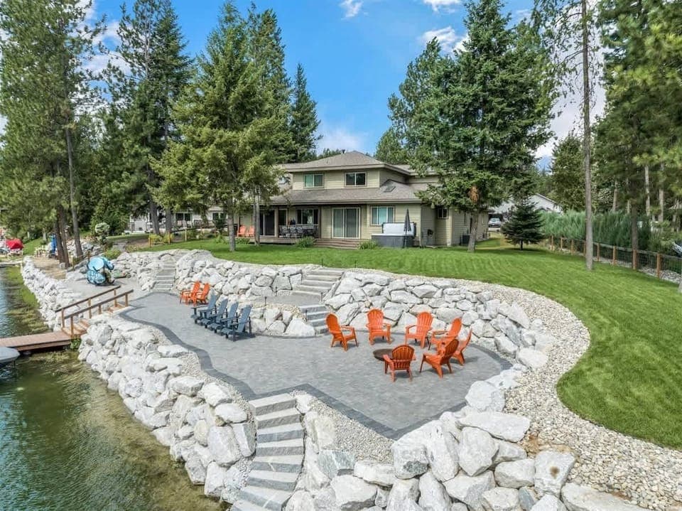 Brand new back yard with a fire pit, lounge area, and easy access to the dock