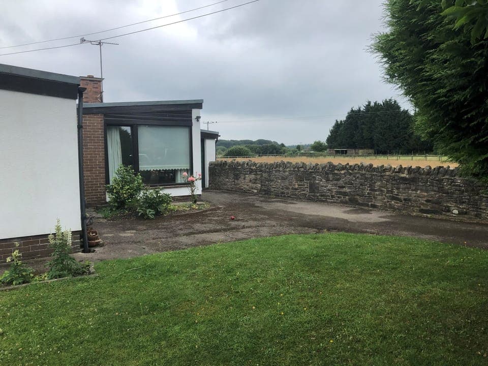 Large front garden with driveway and off-road parking