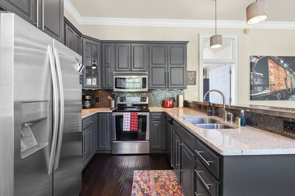 Plenty of counter space and open to the living room, so you won't miss a minute of fun.