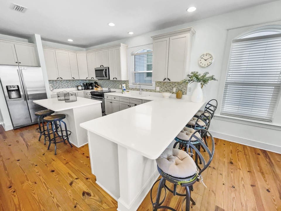 Kitchen with a large island and stools located on the 2nd floor