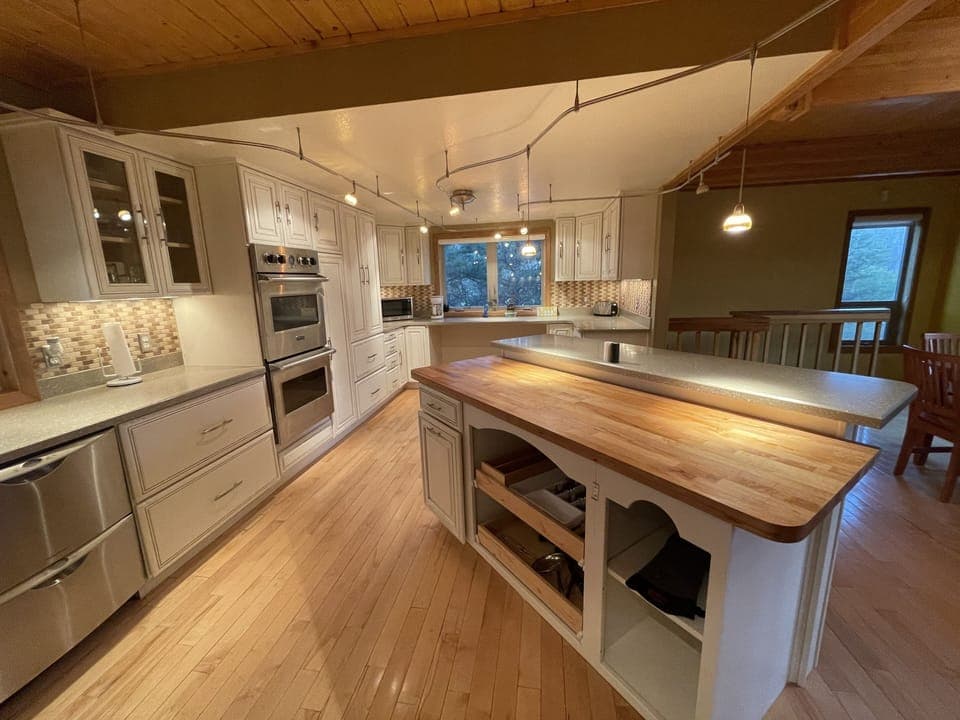 Stocked kitchen with silverware and basic necessities 