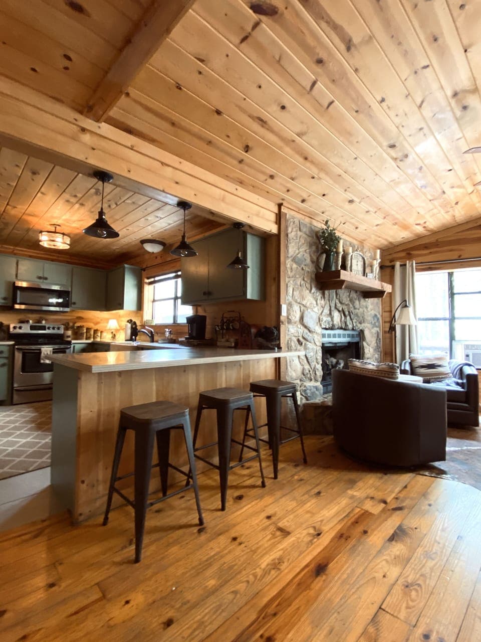 Open concept kitchen looking into living and dining area.