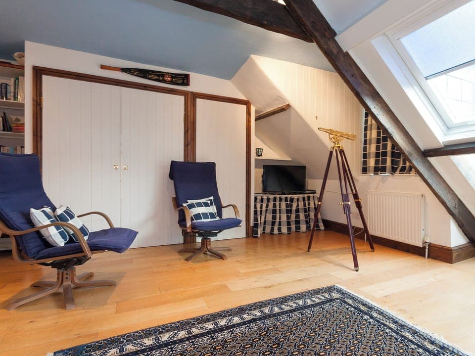 Spacious attic sitting room | Clarence House, Dartmouth