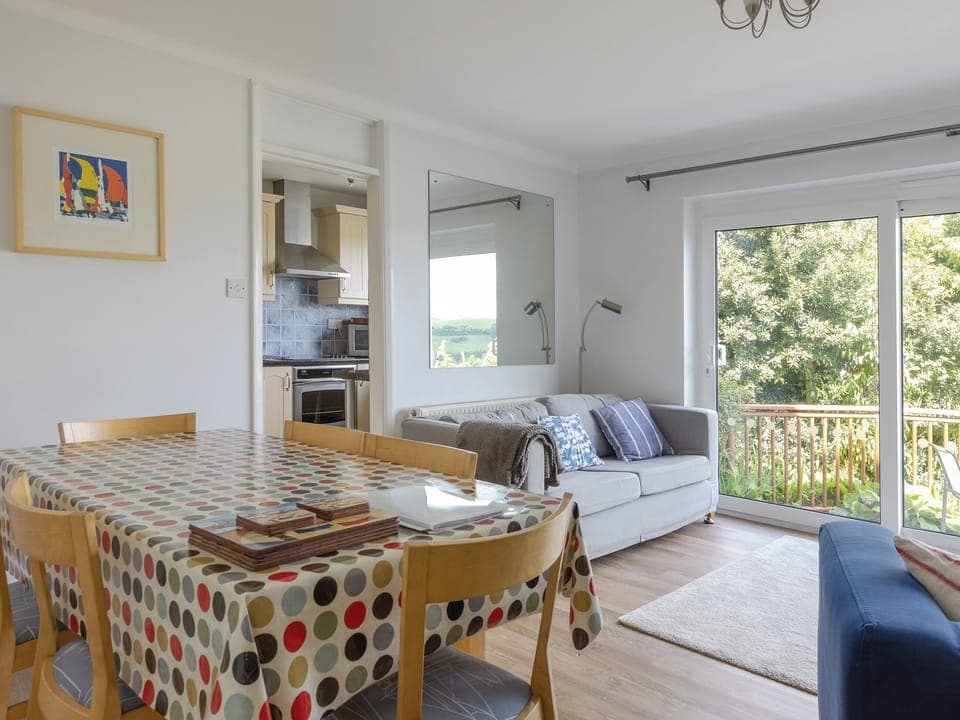 Comfortably furnished sitting and dining room with sliding patio doors | Rockvale 1, 