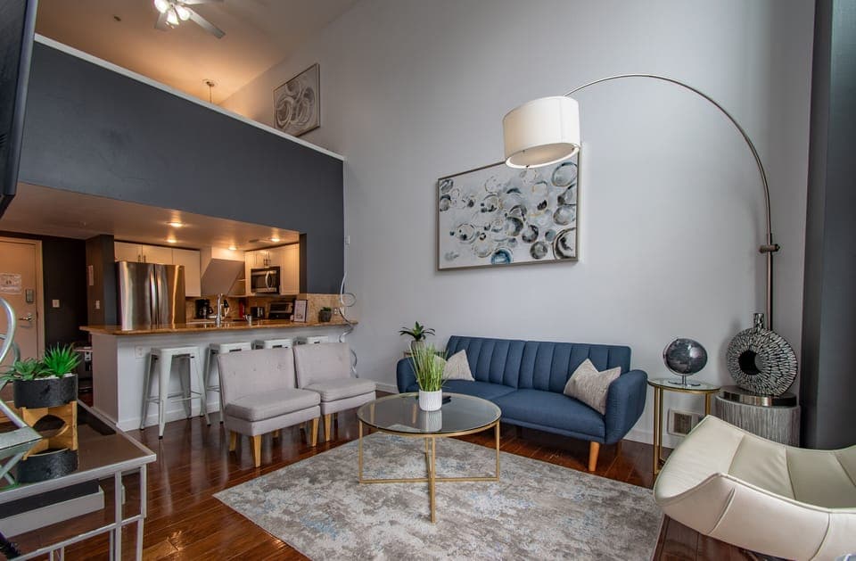 Living Room with a Large TV, Vaulted Ceiling Windows & Sleeper Sofa
