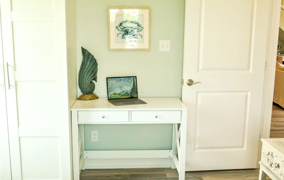 Primary Bed 2 - Computer desk and chair with closet storage.