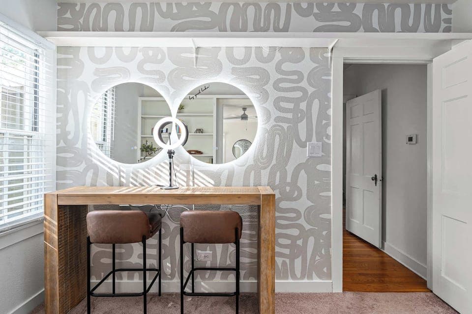 Stylish vanity area with modern lighting and chic design.