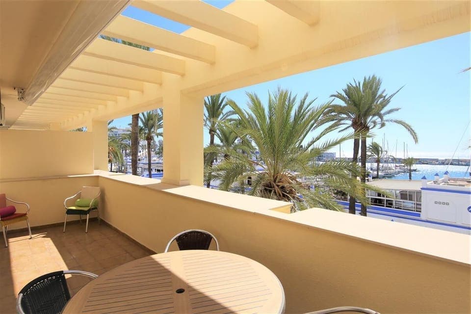 Large south facing balcony with stunning sea and port views