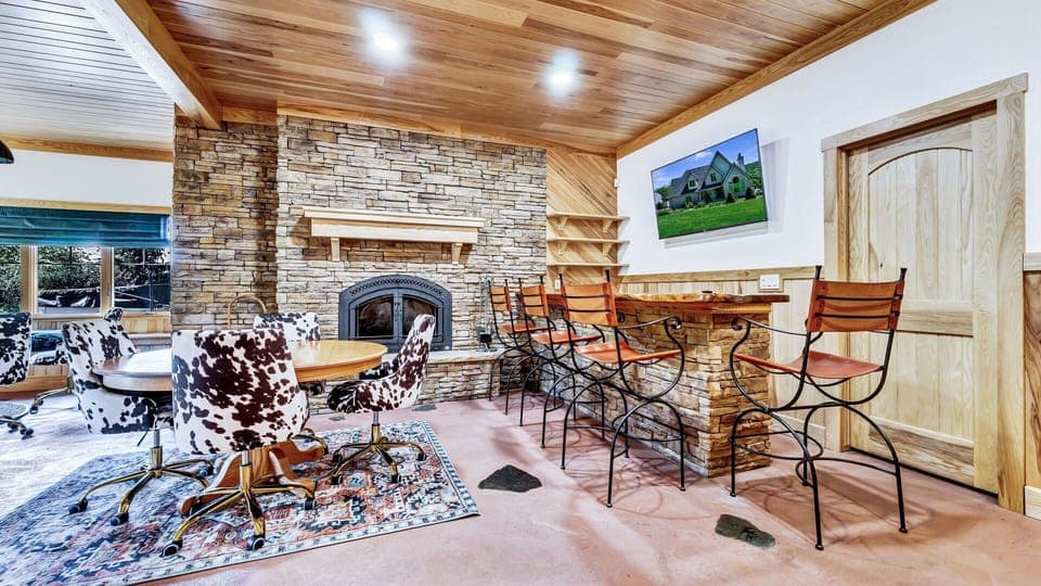 Downstairs - Card and Bills game with a Fireplace; what a great way to stay in. 