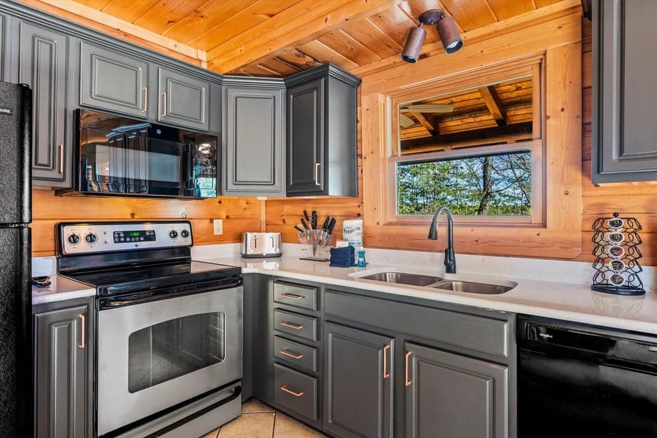 kitchen with granite counters and cookware