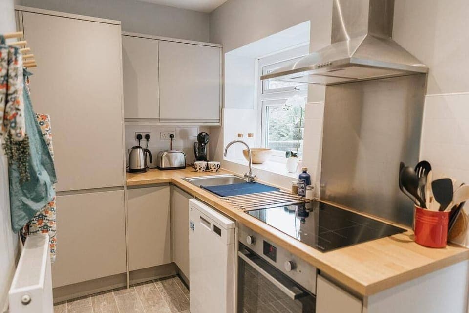 Kitchen with dishwasher and coffee machine 
