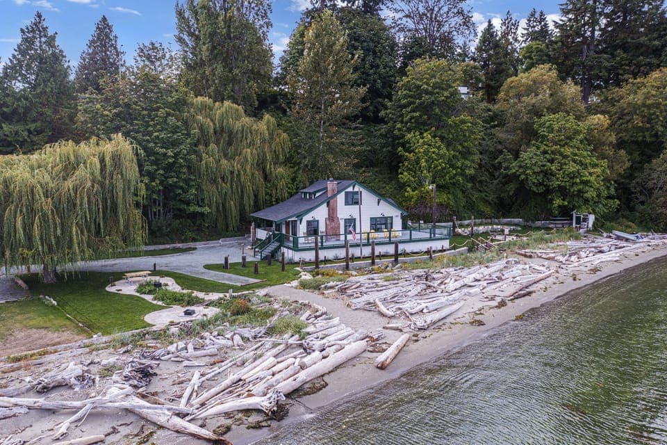 Beautiful beachfront property with driftwood, sand and water for a long walk!