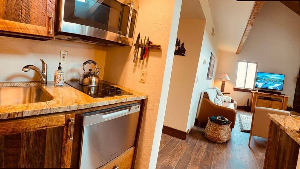 full kitchen with stove, microwave/conventional oven, dishwasher. The pantry is across full of spices and essentials. Fully stocked 